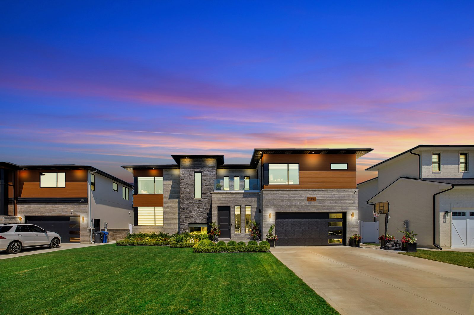 Luxury home at dusk — day-to-dusk sky replacement