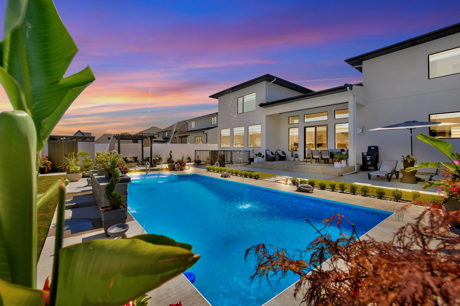 Pool home at dusk — dramatic sky